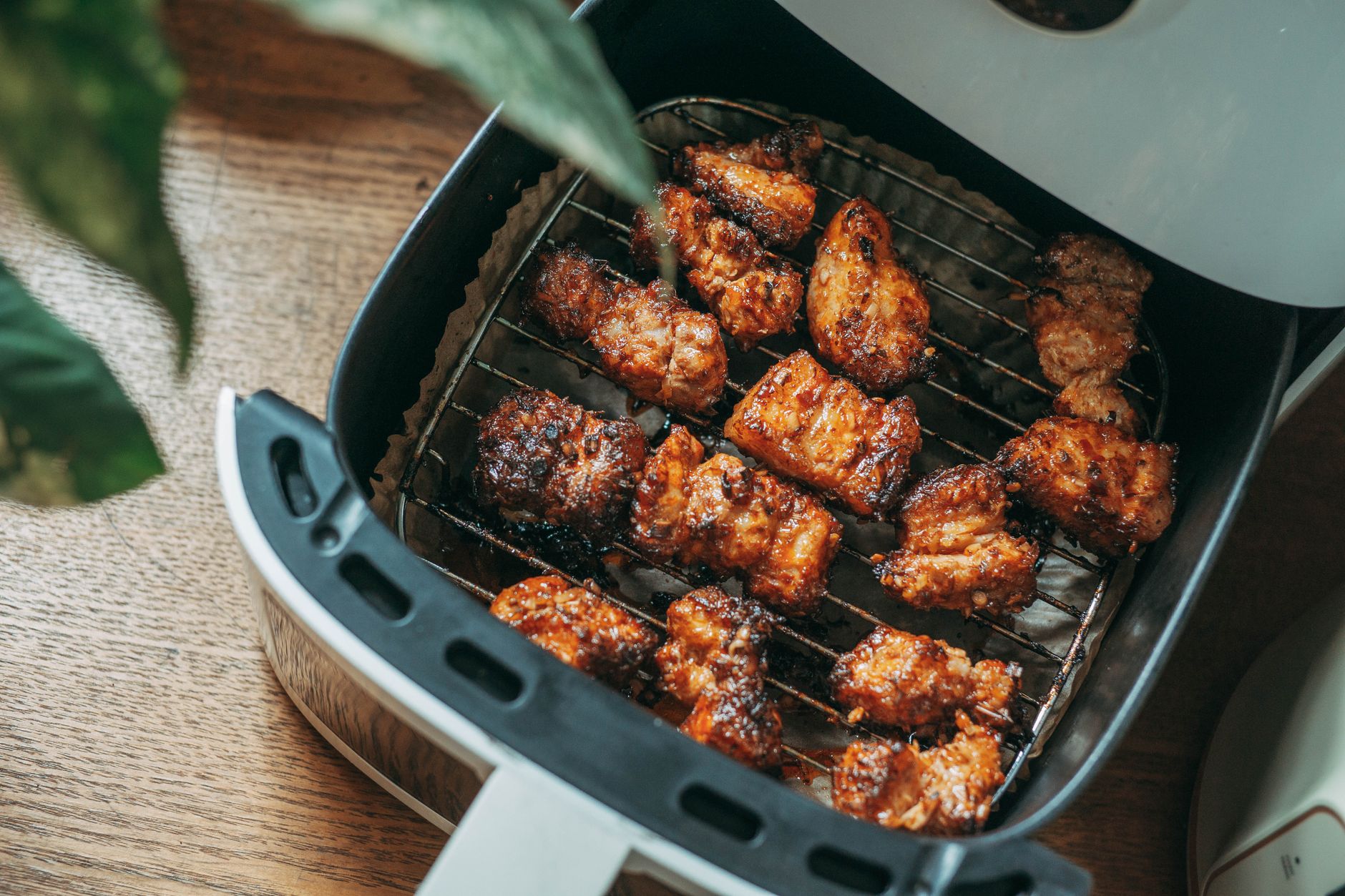 Crispy chicken pieces cooked in a modern air fryer, the kind of result the Emerson SmartVoice air fryer targets