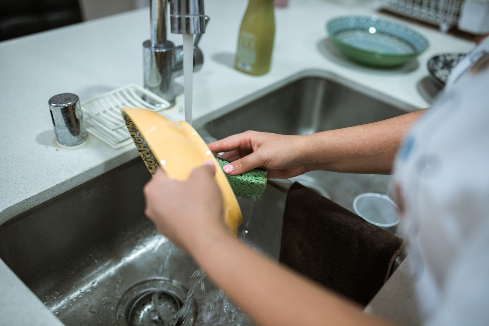Washing an air fryer basket in the sink