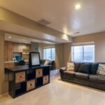Bright basement living room where a dehumidifier controls humidity