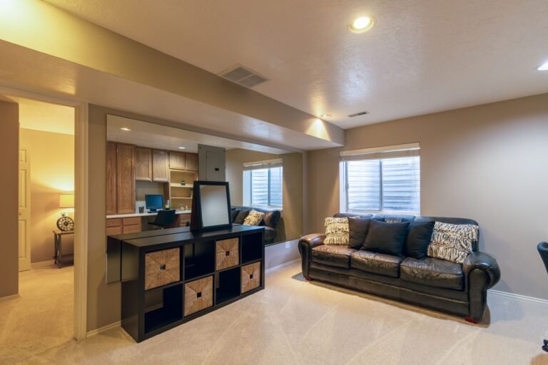 Bright basement living room where a dehumidifier controls humidity
