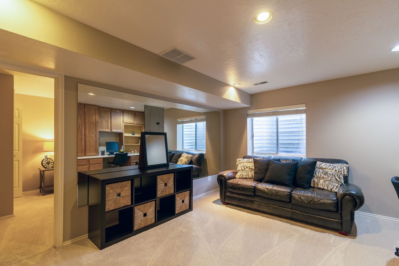 Bright basement living room where a dehumidifier controls humidity