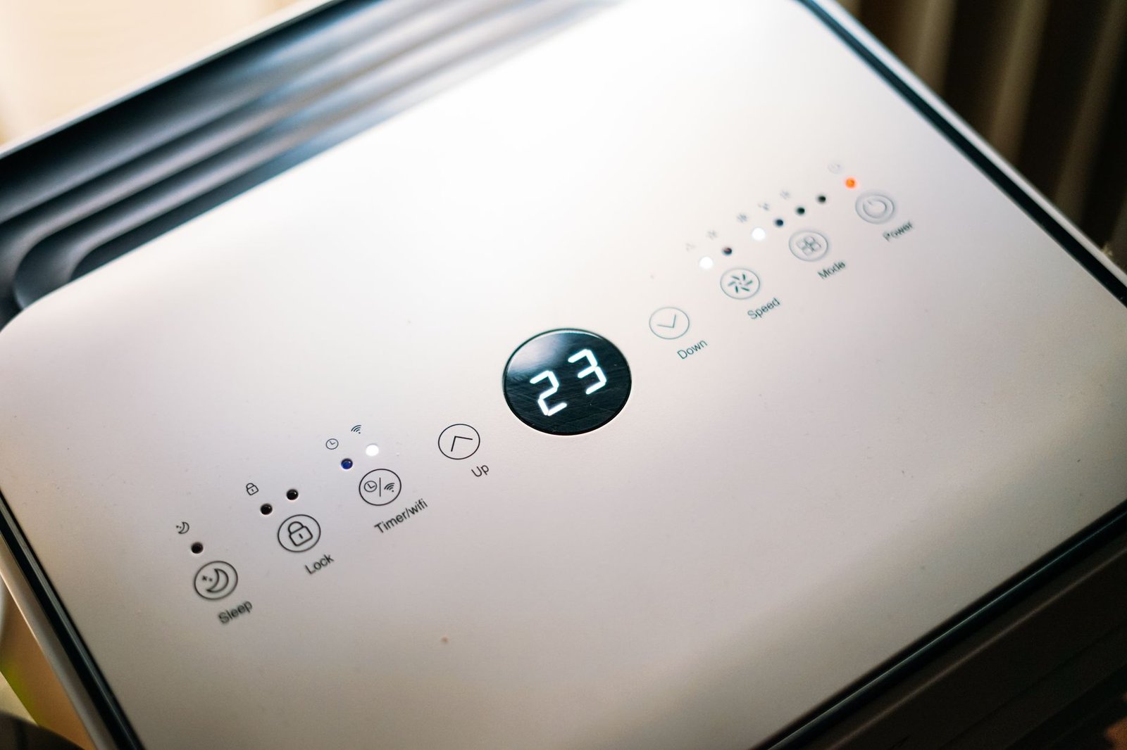 Close-up of a dehumidifier control panel and humidistat