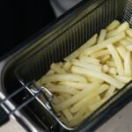 Air fryer on a kitchen counter used for the 2026 cooking-times chart
