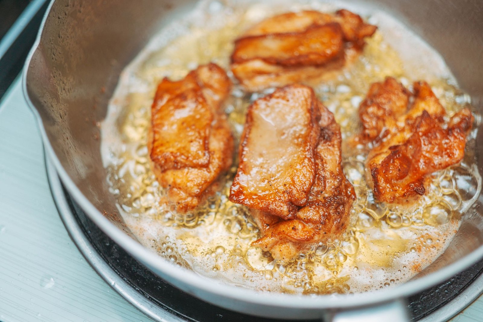 Golden crispy chicken pieces of the kind an air fryer produces