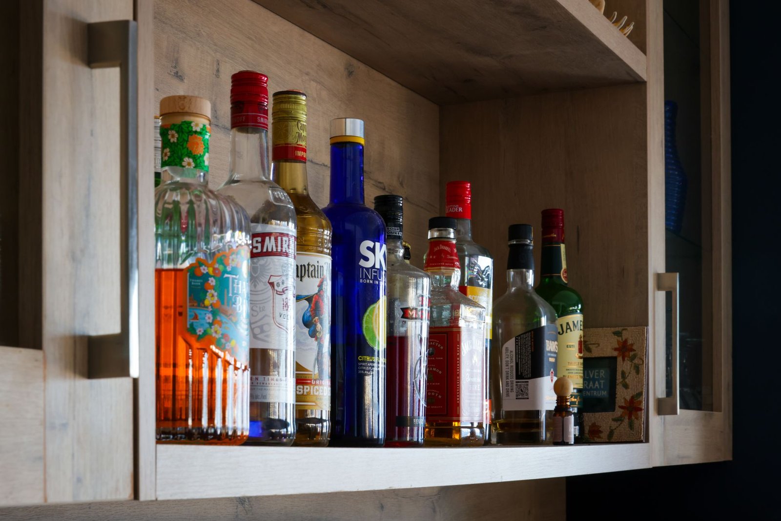 Home bar setup with spirit bottles and cocktail glasses used to test the Barsys 360 and Bartesian