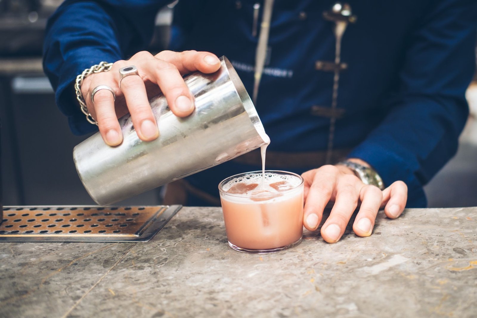 Mixology in progress showing a cocktail being poured, illustrating Barsys 360 and Bartesian drink quality
