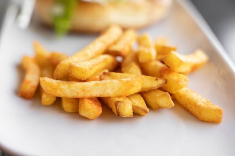 Crispy golden air-fried french fries served on a plate