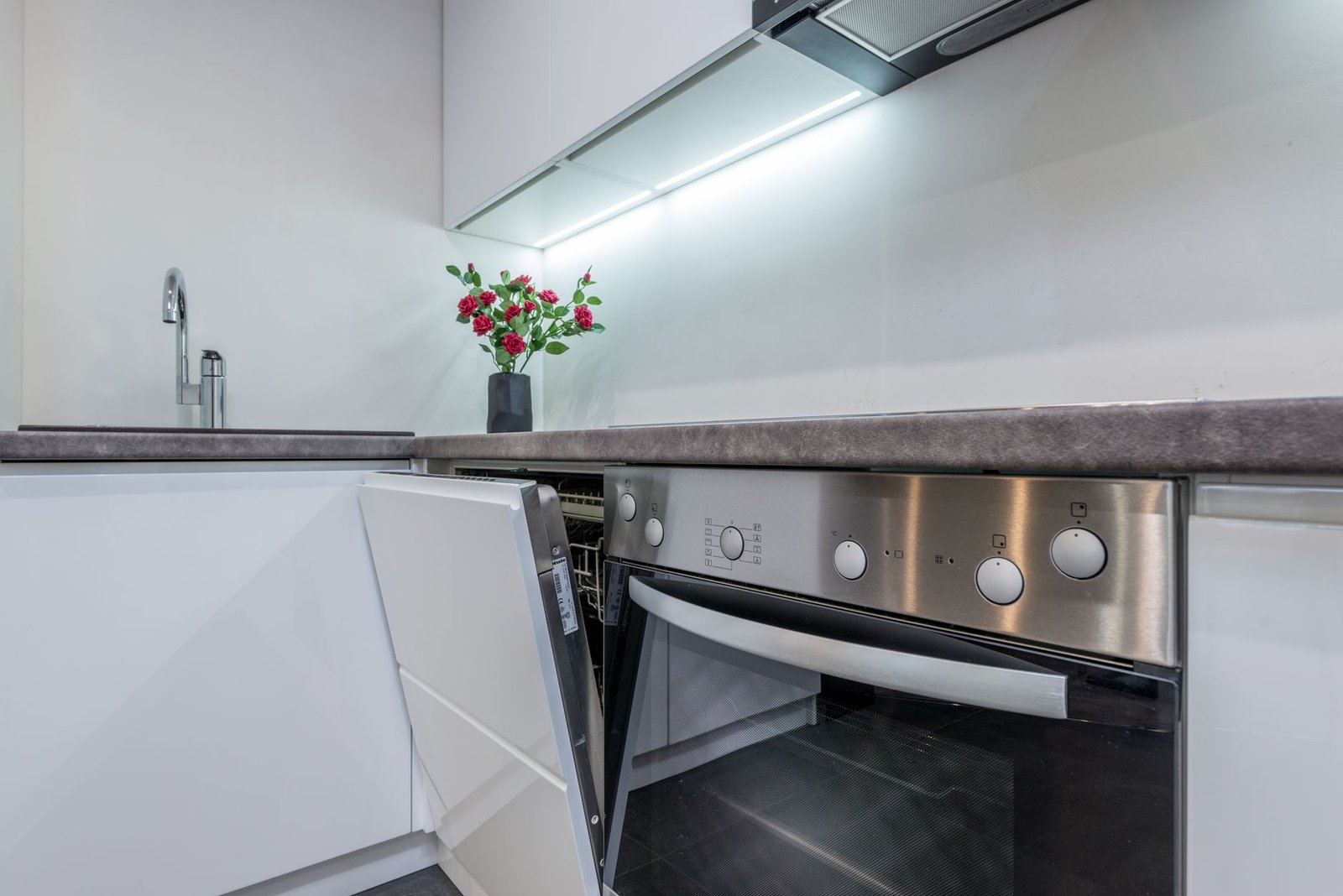 Compact dishwasher in a small apartment kitchen counter