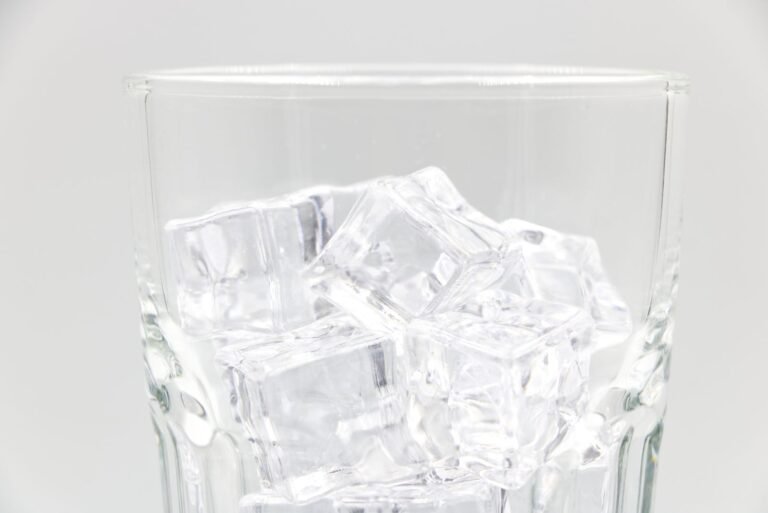 Countertop ice maker ice cubes in a glass, illustrating which machines keep ice frozen longer