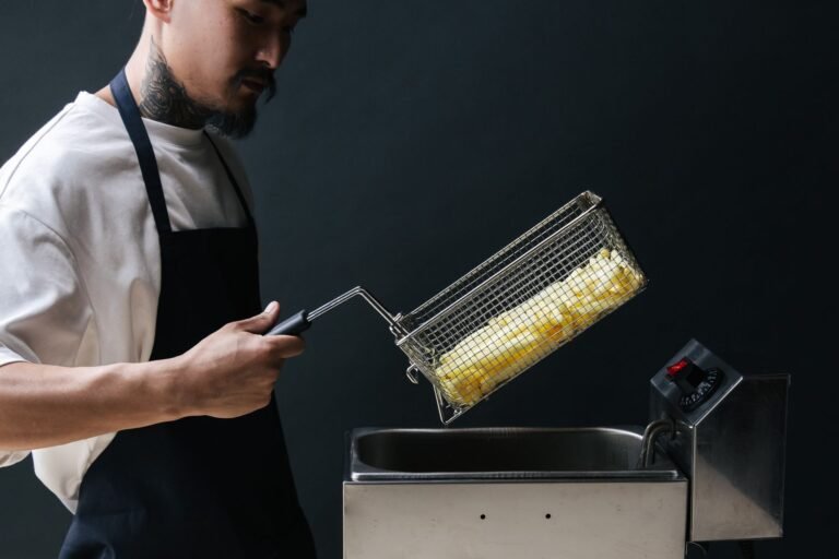 Cuisinart TOA-100 style air fryer cooking crispy food on a kitchen counter