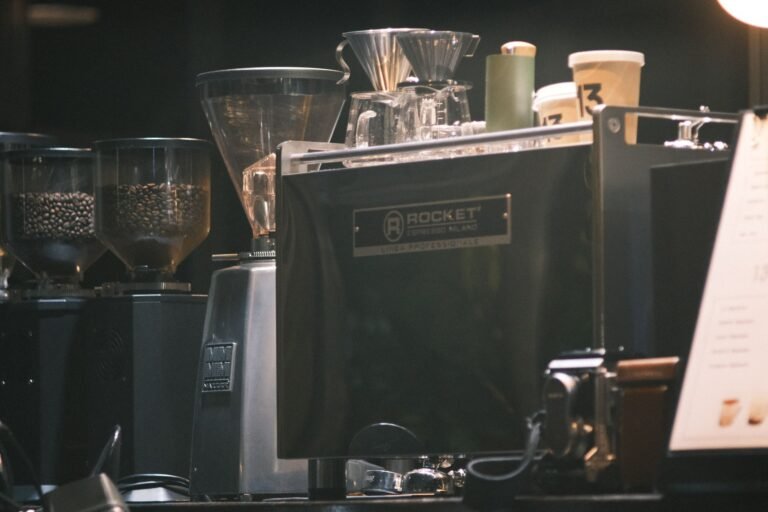 Automatic bean-to-cup espresso machine brewing coffee in a home kitchen
