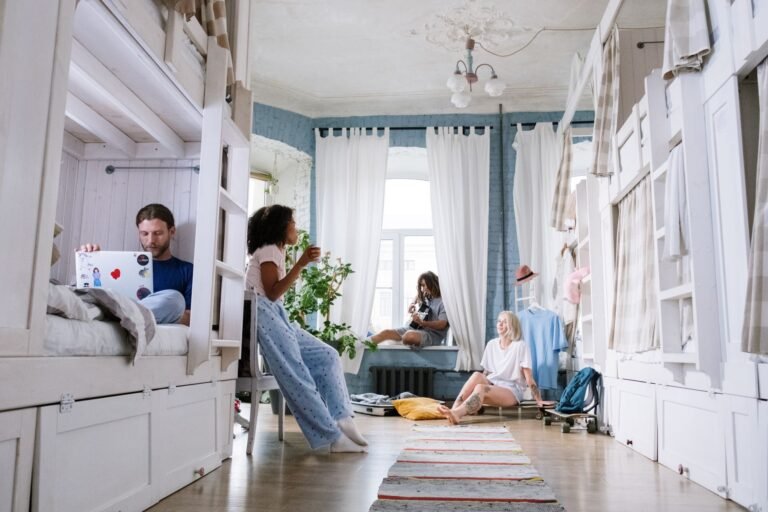 College students relaxing in a cozy dorm room