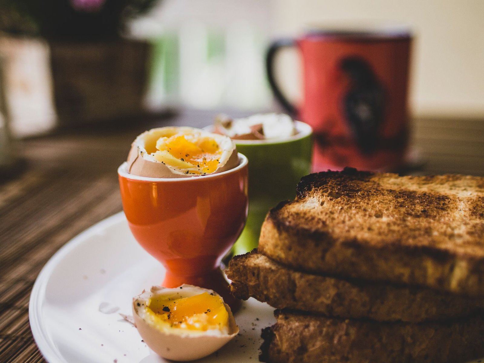 Soft-boiled eggs served with buttered toast for a quick breakfast